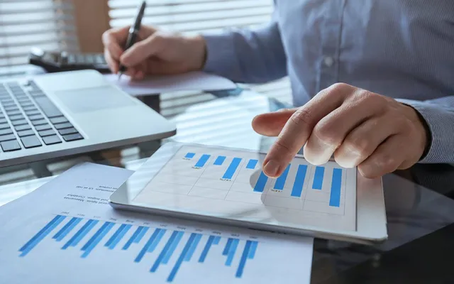 businessman working with financial report charts, business analytics and KPI